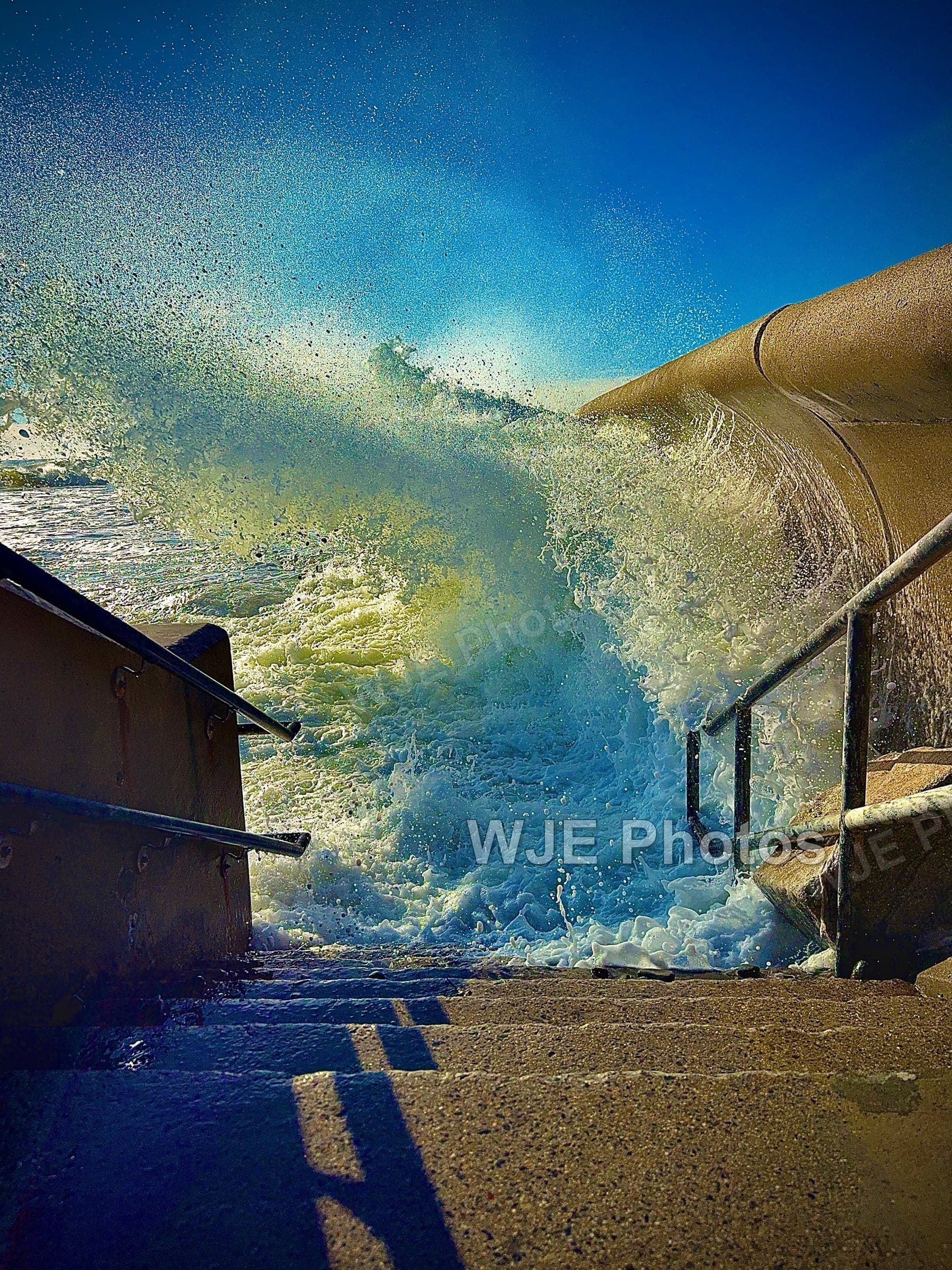 Ocean waves along 6th Street on the New England coast
